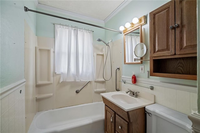 bathroom with tile walls, toilet,  shower combination, and crown molding