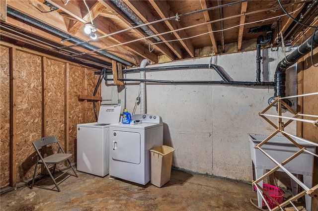 unfinished basement with washer and clothes dryer