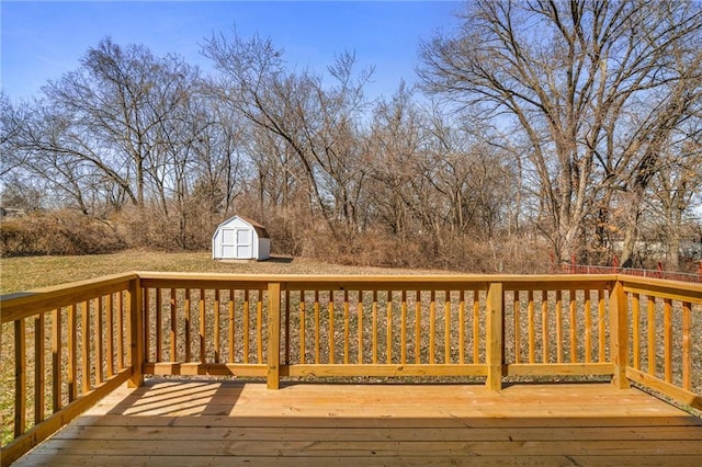 wooden deck with a storage shed and an outdoor structure