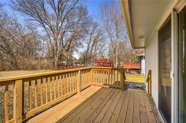 wooden deck featuring fence