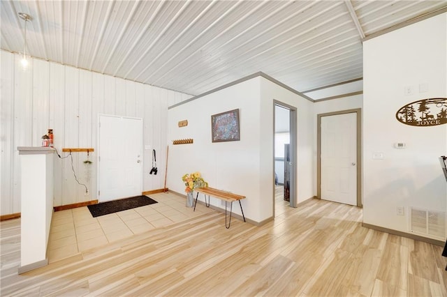 entrance foyer with visible vents, baseboards, and light wood finished floors