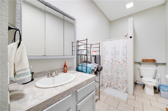 bathroom with tile patterned flooring, curtained shower, toilet, and vanity