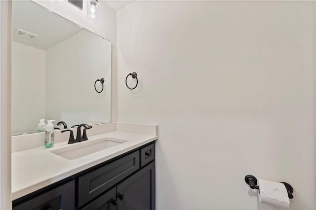 bathroom with vanity and visible vents