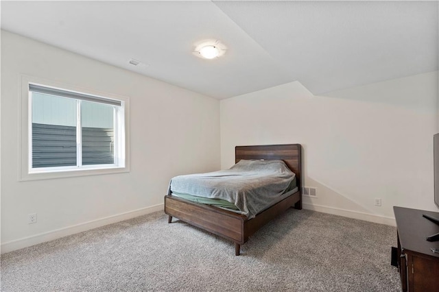 bedroom featuring visible vents, baseboards, and carpet floors