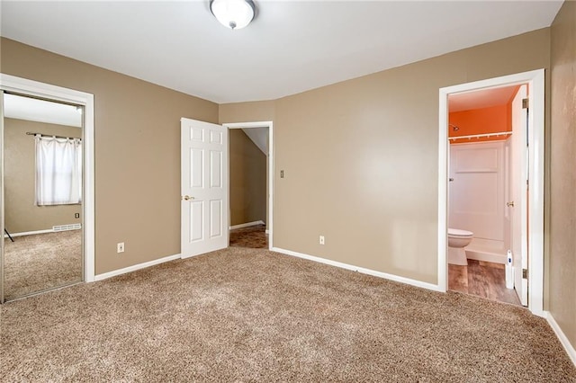 unfurnished bedroom featuring baseboards and carpet