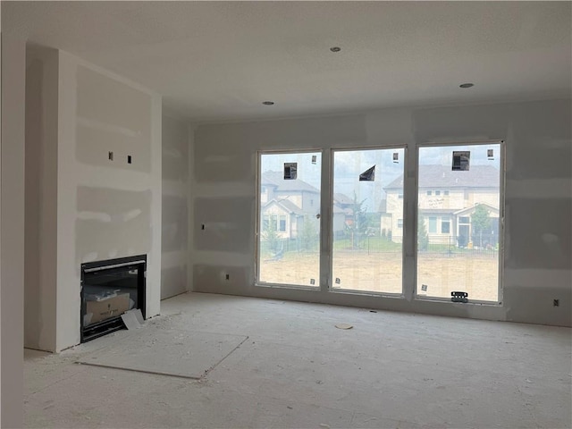 8017 Round Prairie St, Shawnee, KS 66220 - unfurnished living room with plenty of natural light and a fireplace