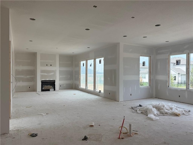 8017 Round Prairie St, Shawnee, KS 66220 - unfurnished living room featuring a fireplace and recessed lighting