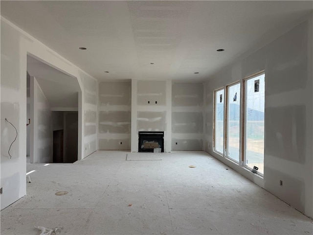 8017 Round Prairie St, Shawnee, KS 66220 - unfurnished living room featuring a fireplace