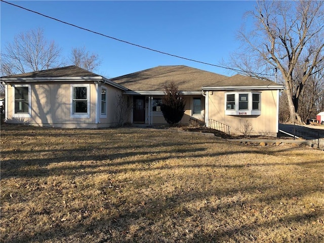 view of front of property with a front lawn