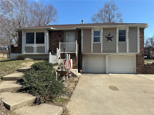 view of front of property with a garage, brick siding, and driveway