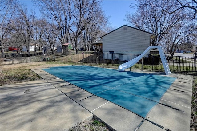 view of swimming pool with fence