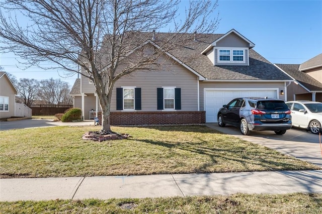 view of front of house with concrete driveway, a garage, brick siding, and a front yard