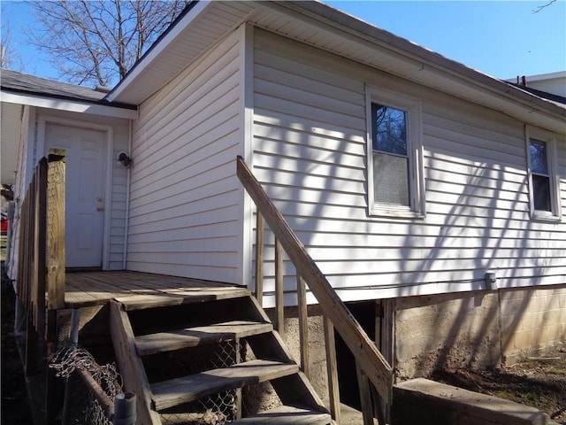 exterior space with roof with shingles