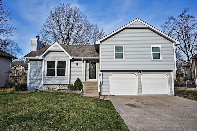 split level home with driveway, a front lawn, fence, a garage, and a chimney