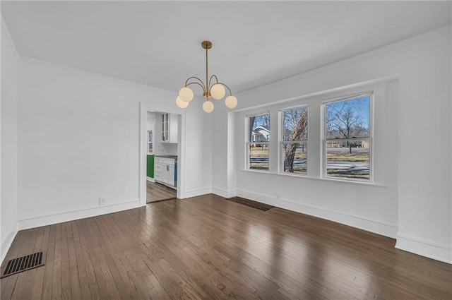 unfurnished dining area with visible vents, baseboards, a notable chandelier, and dark wood-style flooring