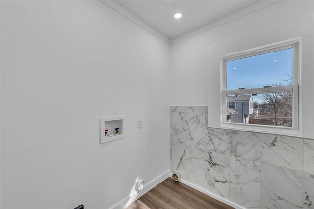 washroom with baseboards, dark wood-style flooring, hookup for a washing machine, and laundry area