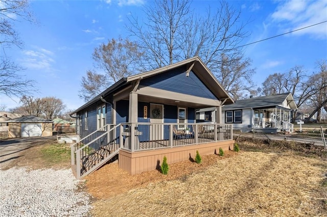 view of front of house with covered porch and an outdoor structure