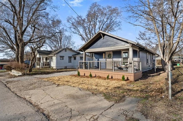 view of front of home with a porch and driveway