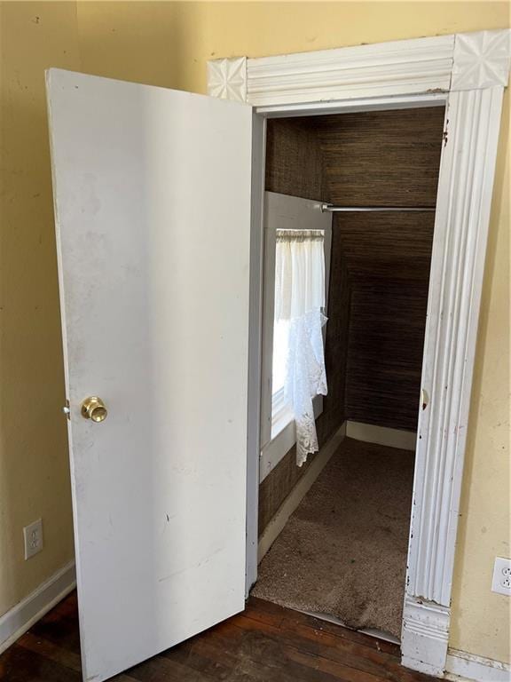 hall featuring wood finished floors