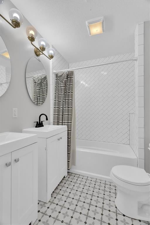 bathroom with vanity, toilet, and shower / bathtub combination with curtain