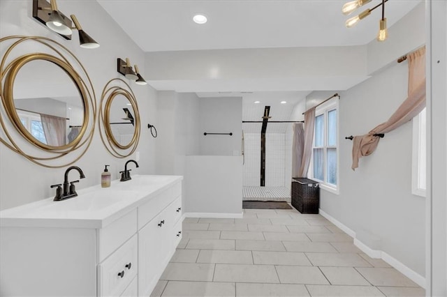 full bath with vanity, recessed lighting, baseboards, and walk in shower