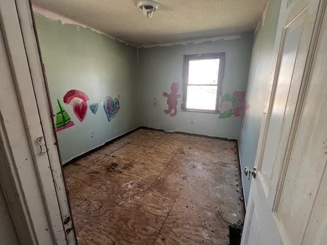 unfurnished bedroom featuring a textured ceiling