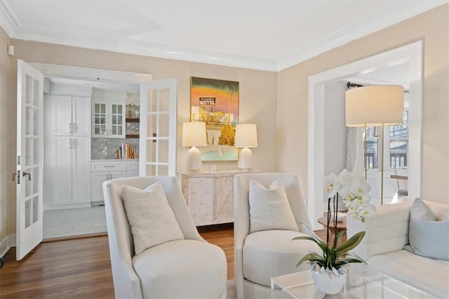 living room with crown molding, dark wood-style floors, and french doors