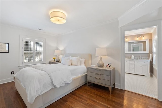 bedroom with dark wood finished floors, crown molding, baseboards, and visible vents