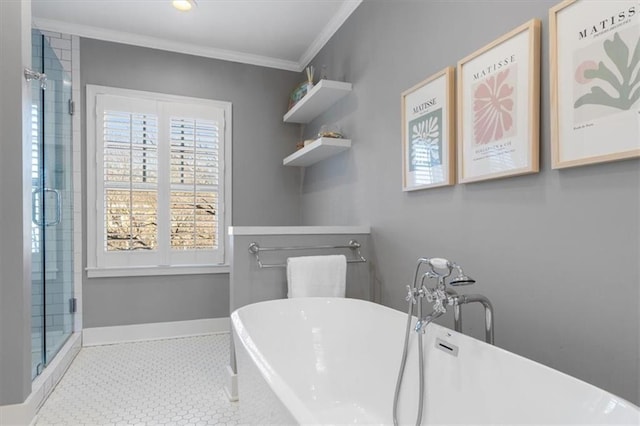 bathroom featuring tile patterned floors, a stall shower, crown molding, baseboards, and a soaking tub