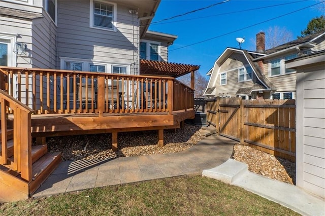 wooden terrace with central AC unit and fence