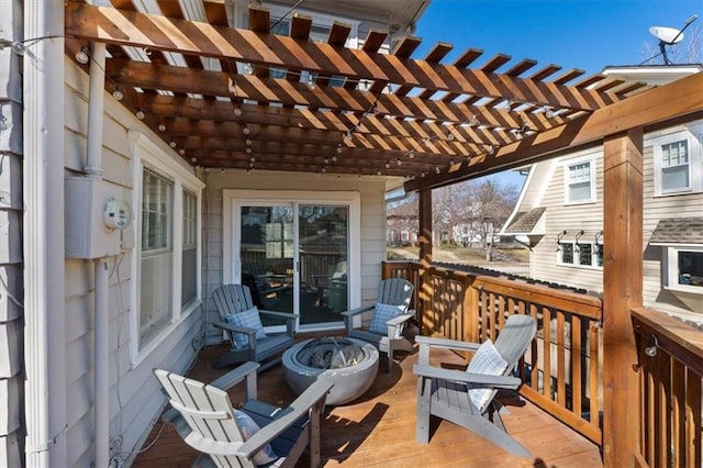 deck with a fire pit and a pergola