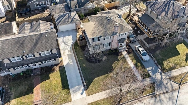 birds eye view of property with a residential view