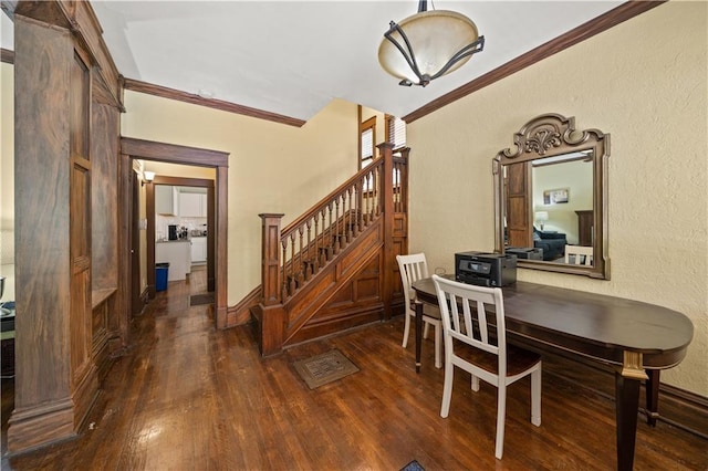 dining room with stairway, wood-type flooring, ornamental molding, and a textured wall