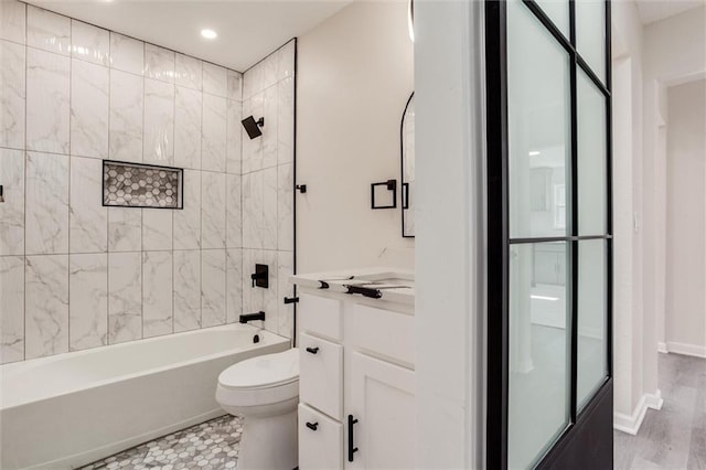 full bathroom featuring vanity, bathing tub / shower combination, toilet, and recessed lighting