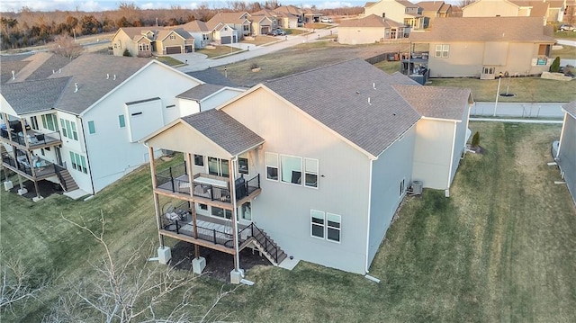 birds eye view of property with a residential view