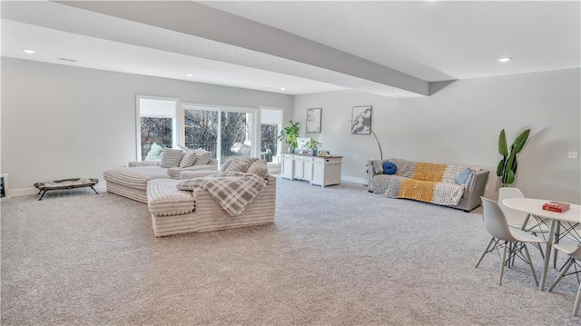 carpeted living area featuring recessed lighting and baseboards