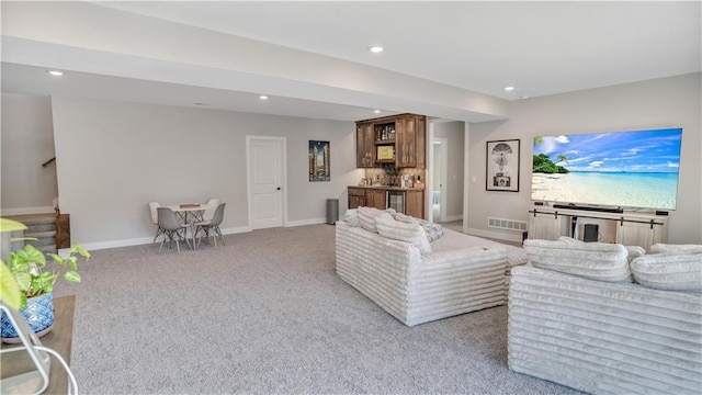 living room featuring stairway, recessed lighting, visible vents, and baseboards