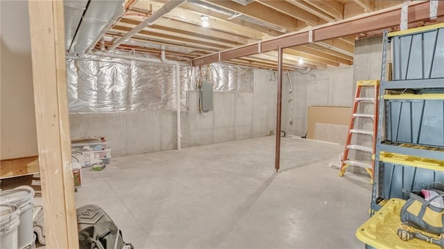 unfinished basement featuring electric panel