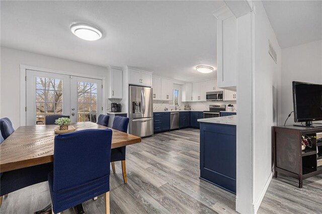 1008 Bristol Way, Liberty, MO 64068 - dining area featuring light wood finished floors, visible vents, and french doors