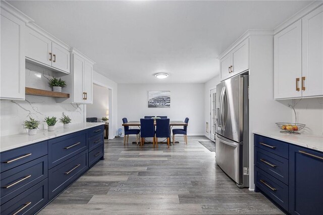 1008 Bristol Way, Liberty, MO 64068 - kitchen with blue cabinetry, stainless steel fridge, and white cabinetry