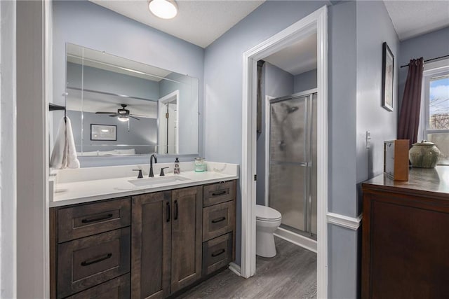 1008 Bristol Way, Liberty, MO 64068 - full bath featuring vanity, toilet, wood finished floors, and a shower stall