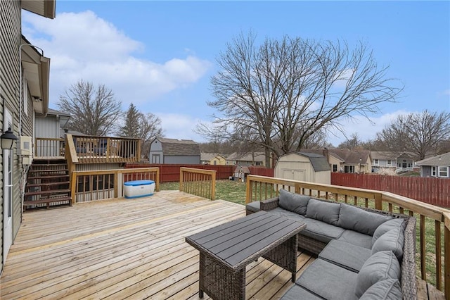 1008 Bristol Way, Liberty, MO 64068 - wooden deck featuring an outbuilding, an outdoor living space, a fenced backyard, a storage unit, and a residential view