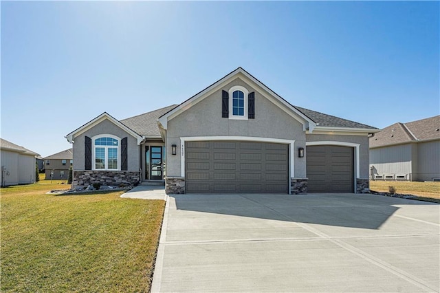 view of front of house with a front yard, driveway, stucco siding, a garage, and stone siding