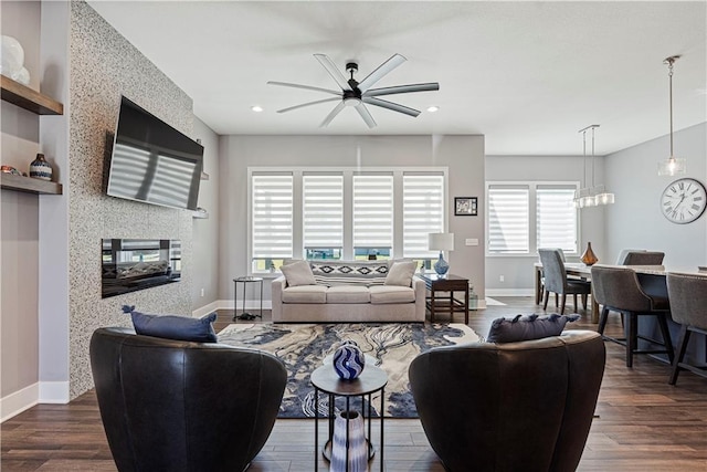 living area with recessed lighting, baseboards, dark wood-style floors, and a ceiling fan