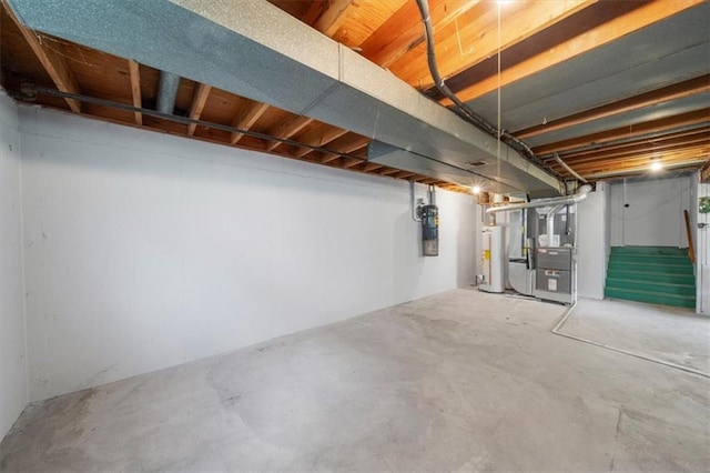 unfinished basement with gas water heater, stairway, and heating unit