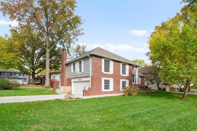 view of front of house with driveway, a front yard, a garage, brick siding, and a chimney