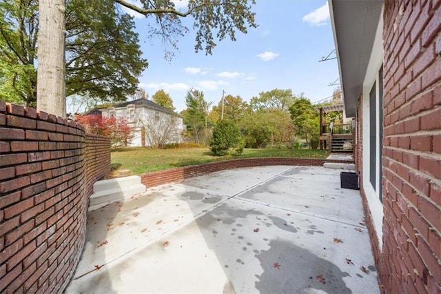 view of patio / terrace featuring fence