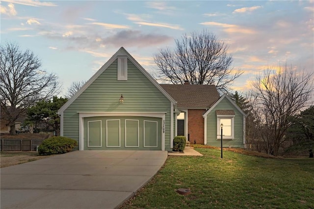 12109 Overbrook Ct, Leawood, KS 66209 - view of front facade with a lawn and concrete driveway