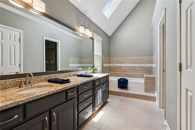 12109 Overbrook Ct, Leawood, KS 66209 - full bathroom with a skylight, double vanity, a garden tub, vaulted ceiling, and tile patterned flooring