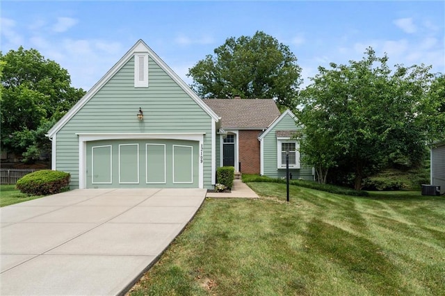12109 Overbrook Ct, Leawood, KS 66209 - view of front of house featuring a front yard, driveway, and a garage